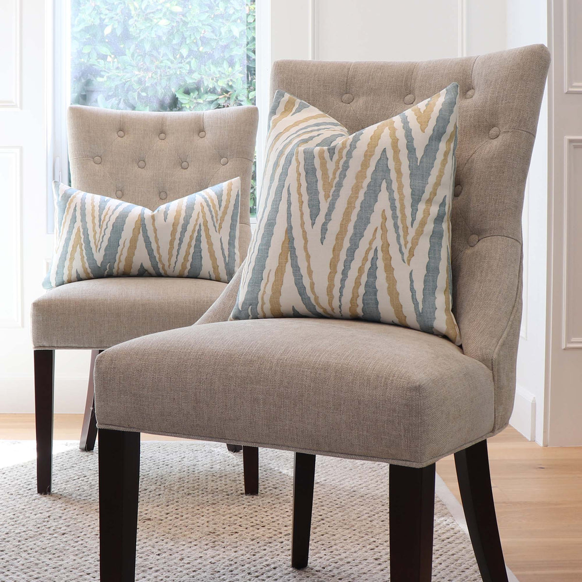 Thibaut Anna French Highland Peak Turquoise Chevron Printed Linen Designer Decorative Throw Pillow Cover on Tufted Chairs in Home Decor