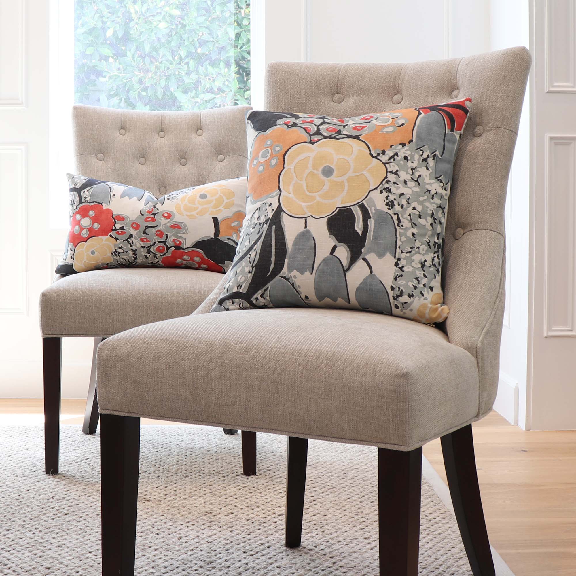 https://www.chloeandolive.com/cdn/shop/products/Thibaut-Anna-French-Laura-AF23103-Coral-Orange-Black-Floral-Linen-Designer-Decorative-Throw-Pillow-Cover-on-Dining-Chairs-in-Home_5000x.jpg?v=1681184645