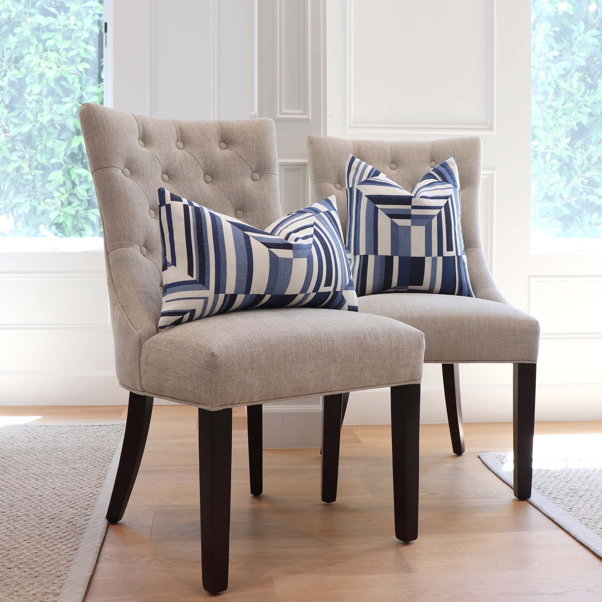 https://www.chloeandolive.com/cdn/shop/products/Thibaut-Cubism-Geometric-Blue-White-Stripes-Linen-Designer-Luxury-Decorative-Throw-Pillow-Cover-on-Dining-Chairs-in-Home_5000x.jpg?v=1660332637