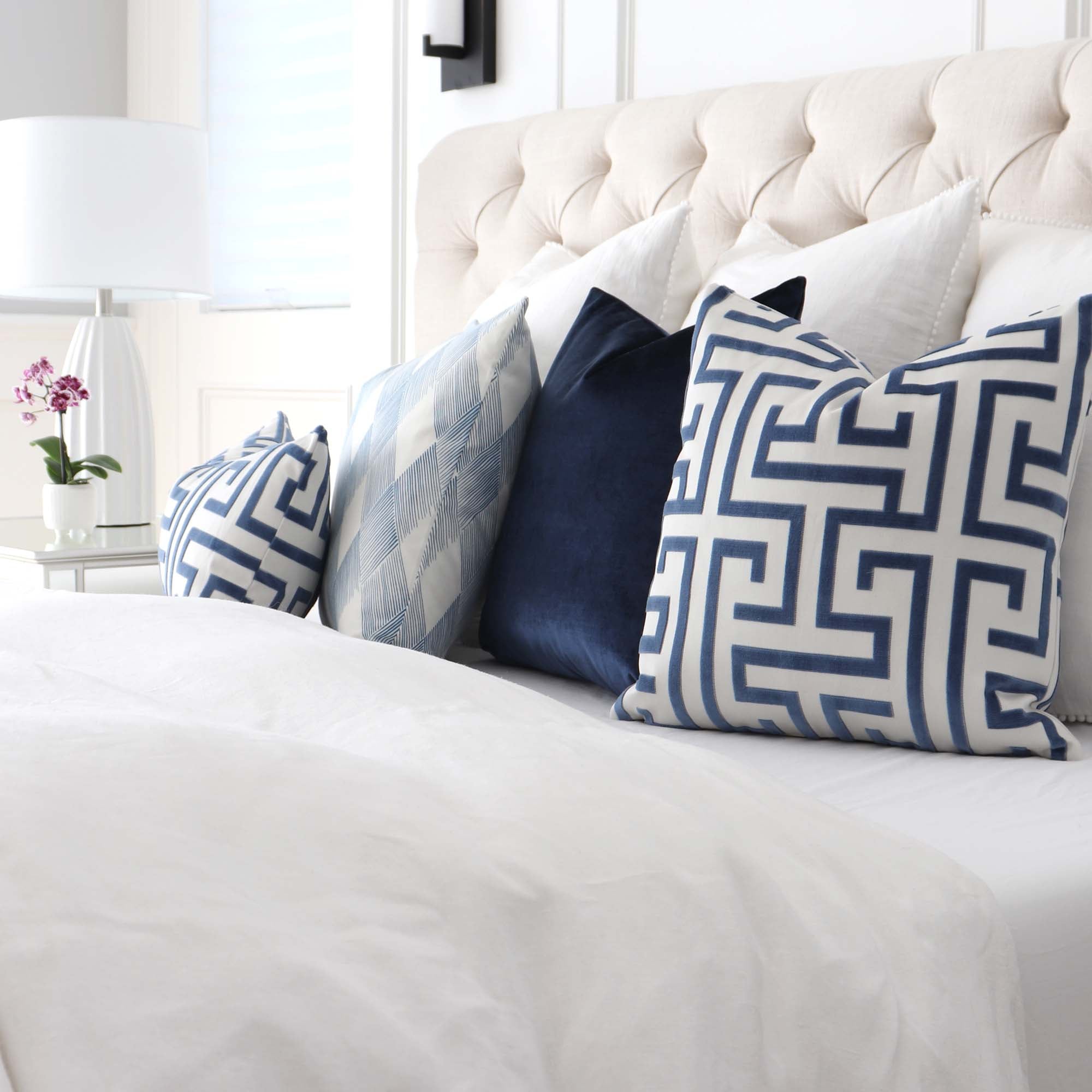 https://www.chloeandolive.com/cdn/shop/products/Thibaut-Ming-Trail-Velvet-Navy-Blue-Luxury-Designer-Throw-Pillow-Cover_W775471-In-Bedroom_5000x.jpg?v=1617850671