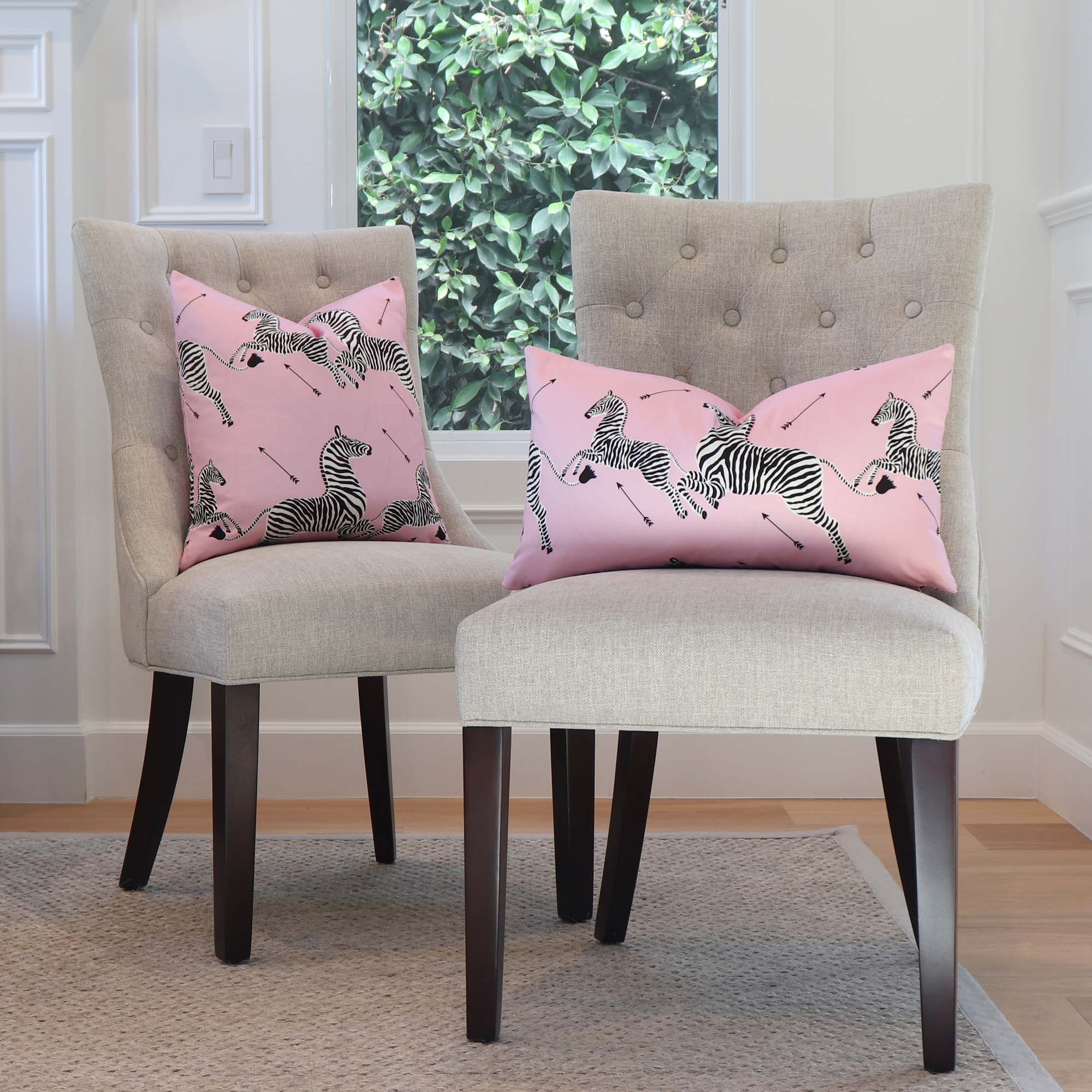 Scalamandre Zebras Petite Peony Pink Designer Animal Print Throw Pillow Cover on Chairs in Living Room