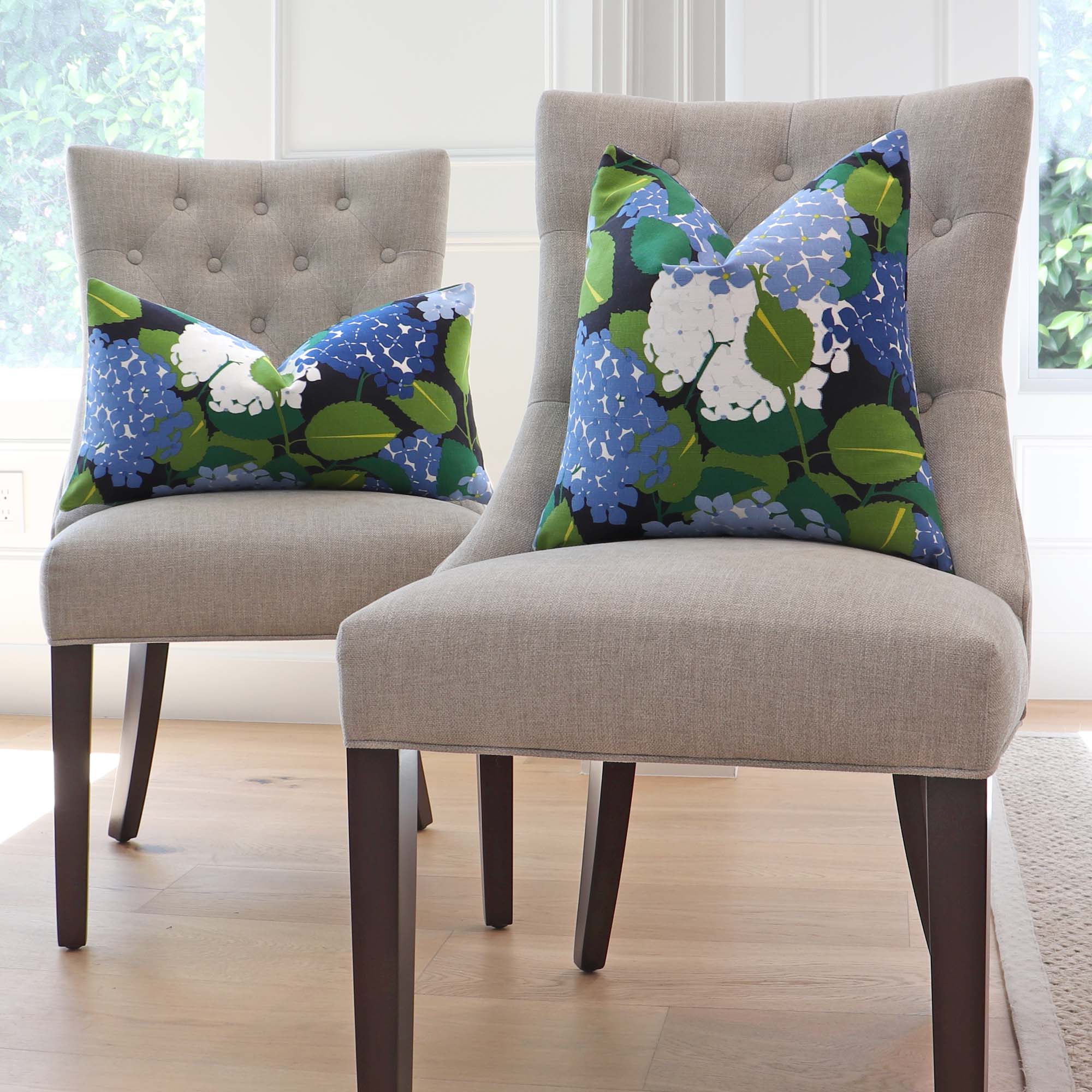 https://www.chloeandolive.com/cdn/shop/products/schumacher-hydrangea-document-blue-177580-floral-designer-luxury-decorative-throw-pillow-cover_scenic_chairs_5000x.jpg?v=1659576109