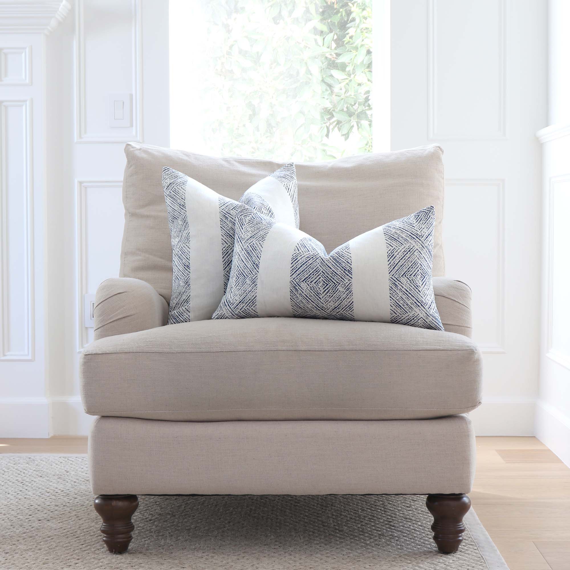 Thibaut Clipperton Stripe Navy and White Designer Luxury Linen Throw Pillow Cover on Accent Chair in Living Room