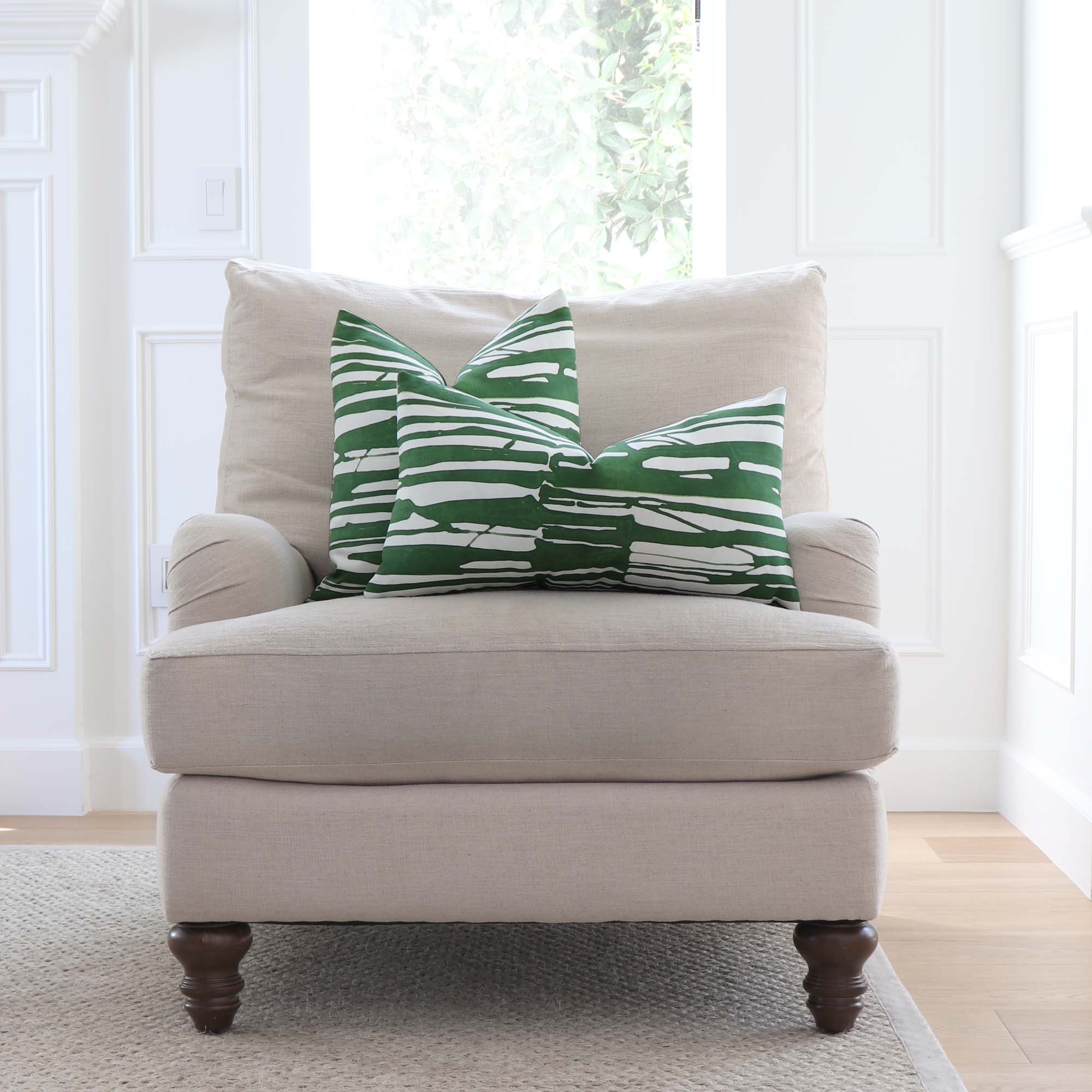 Thibaut Ischia Stripe Emerald Green and White Designer Throw  Pillow Cover on Arm Chair in Living Room